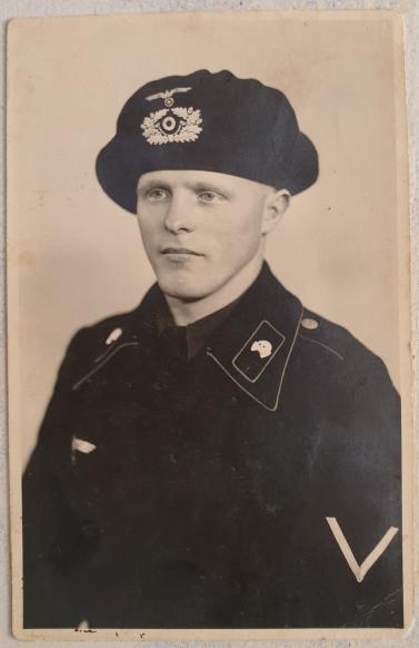 Very nice portrait photo of a Panzer man, wearing a schutzmütze (panzer beret)